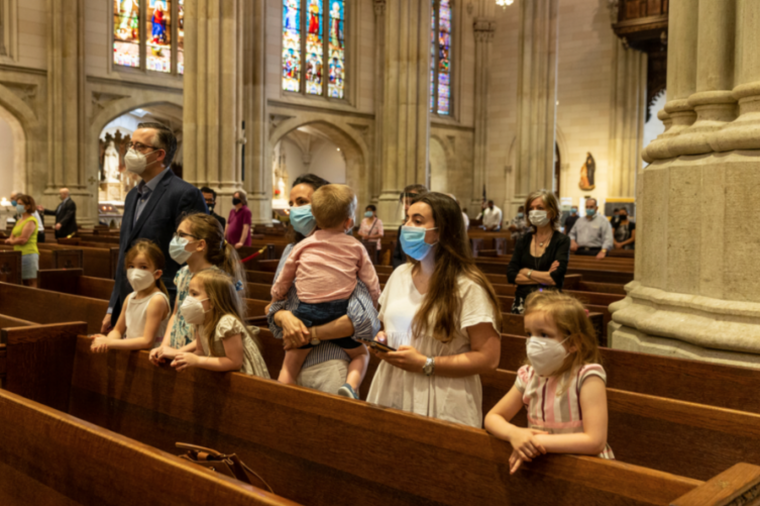 A family prays in St. Patrick's Cathedral in New York. (lev radin/Shutterstock)