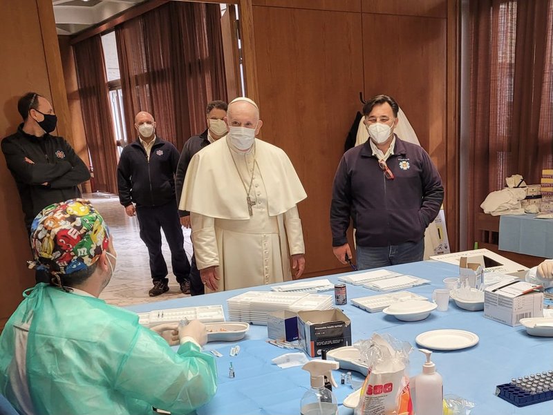 Pope Francis visits a COVID-19 vaccination clinic in the Paul VI hall at the Vatican April 2, 2021. The Vatican is providing vaccinations against COVID-19 to the poor and refugees and is expected to serve 1,200 people. (CNS photo/Holy See Press Office)