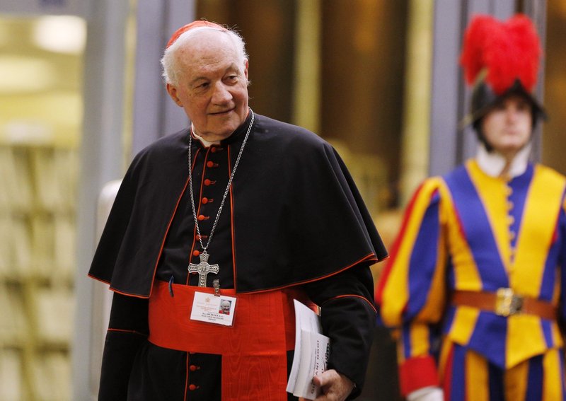 Cardinal Marc Ouellet, prefect of the Congregation for Bishops, leaves the opening session of the Synod of Bishops on young people, the faith and vocational discernment at the Vatican in this Oct 3, 2018, file photo. Cardinal Ouellet announced plans for a major international conference at the Vatican in 2022 on the theology of the priesthood. (CNS photo/Paul Haring)