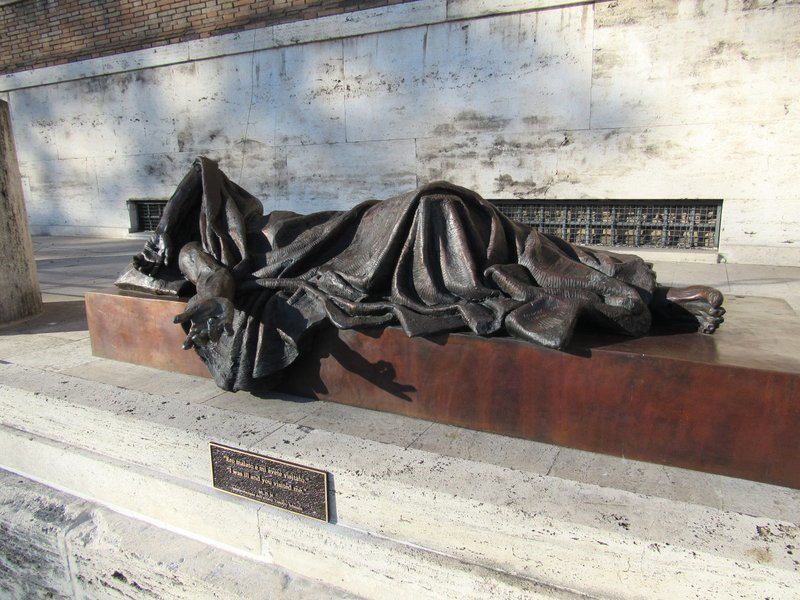 Timothy Schmalz's sculpture "When I Was Sick" is displayed on a Rome street Feb. 9, 2017. The artist will create a replica of the statue that will be part of a COVID-19 memorial planned for Mercy Health -- St. Elizabeth Youngstown Hospital in Ohio. The memorial is expected to be completed sometime in September 2021. (CNS photo/courtesy St. Elizabeth Youngstown Hospital)