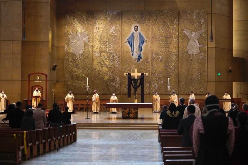 Catholics attend a special national Mass on the feast of St. Joseph at the Cathedral of Our Lady of the Angels in Los Angeles March 19, 2021, amid the coronavirus pandemic. Archbishop José H. Gomez of Los Angeles, president of the U.S. Conference of Catholic Bishops, was the celebrant. (Isabel Cacho, courtesy Archdiocese of Los Angeles)