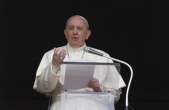 Pope Francis greets the crowd as he leads the "Regina Coeli" from the window of his studio overlooking St. Peter's Square at the Vatican April 18, 2021. (Paul Haring/CNS)