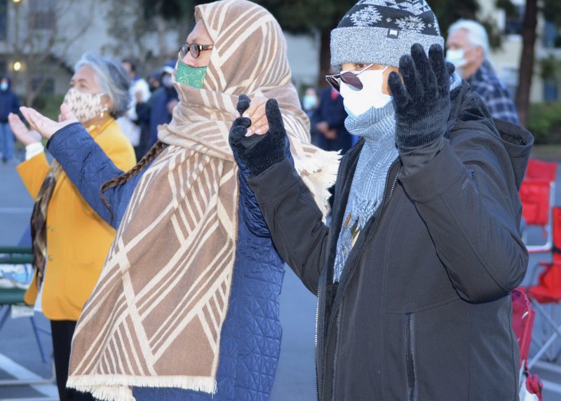 Asian and Pacific Islander Catholics are seen during Mass outside Good Shepherd Church in San Diego April 15, 2021. Bishop Robert W. McElroy celebrated a Mass for racial healing, with Auxiliary Bishop John Dolan and over a dozen priests as concelebrants. (CNS photo/Aida Bustos, The Southern Cross)