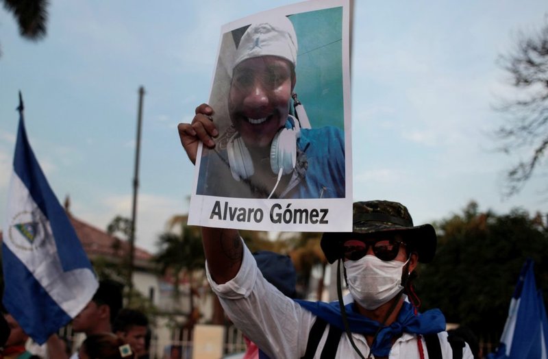 A man holds a photo of Álvaro Gómez during a protest in Managua, Nicaragua, May 10, 2018. Gómez was killed during a protest over reforms of pension plans of the Nicaraguan Social Security Institute. The protest was organized by the Mothers of April Movement to demand justice from President Daniel Ortega's government. (Oswaldo Rivas/Reuters via CNS)