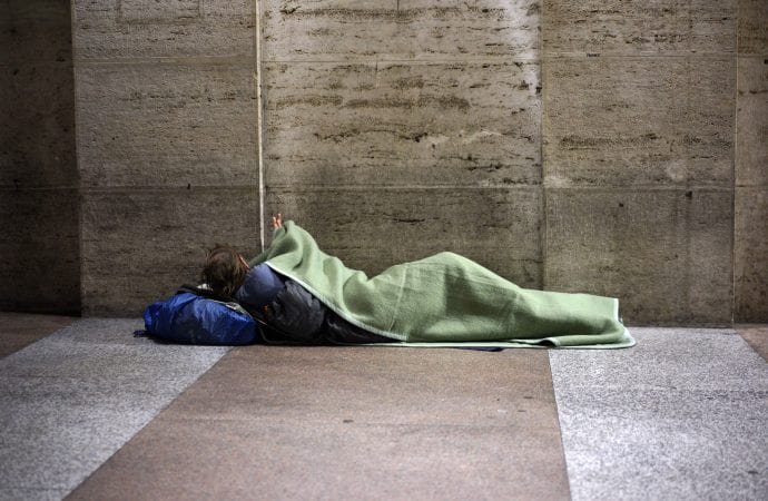 In this photo taken Thursday, Nov. 16, 2017, a homeless man prepares to spend the night under a covered walkway of a building close to the Vatican, in Rome. (Andrew Medichini/AP via Crux)