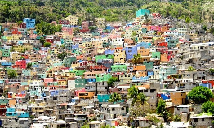 Informal housing spreads across the hillsides in Jalousie, Haiti. (USAID via Crux)