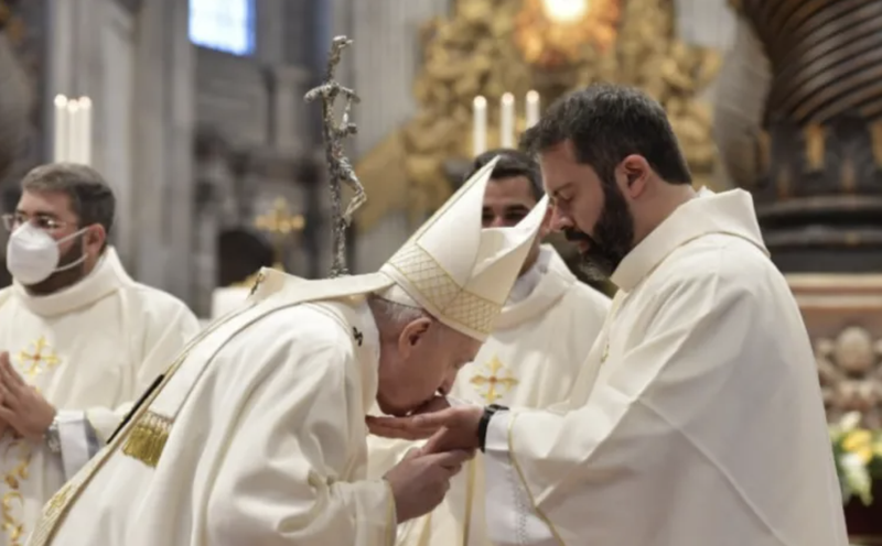 Pope Francis kisses the hands of a newly ordained priest in St. Peter’s Basilica, April 25, 2021. (Vatican Media)