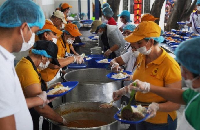 Volunteers from a Catholic charity prepare meals at the Divine Providence food pantry in Cucuta, Colombia, Jan. 31, 2020. The food pantry serves up to 6,000 people per day, mostly Venezuelan migrants. (Manuel Rueda/CNS)