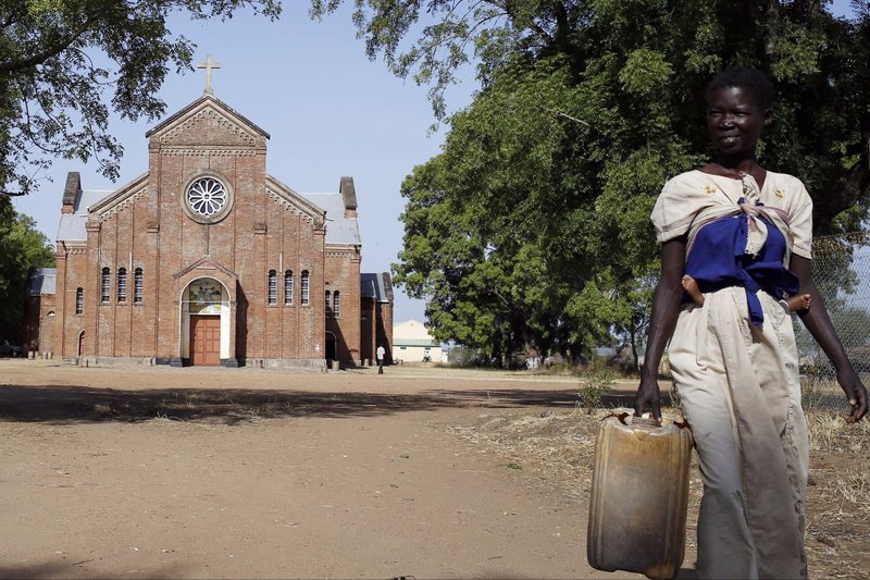A young woman outside a church in Rajaf, South Sudan. (CNS/Matthieu Alexandre, Caritas Internationalis)