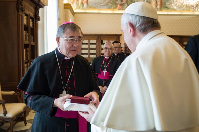 Pope Francis greets Bishop Cornelius Sim, apostolic vicar of Brunei, during his "ad limina" visit to the Vatican in this Feb. 8, 2018, file photo. Bishop Sim was among 13 new cardinals named by Pope Francis Oct. 25. (CNS photo/Vatican Media)
