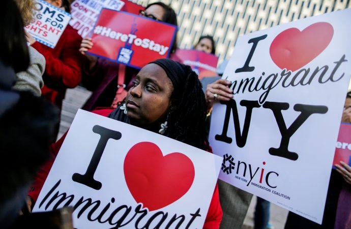 Haitian immigrants and supporters in New York City hold placards in support of Temporary Protected Status in this 2017 file photo. On May 22, 2021, the Biden administration granted eligible Haitian nationals living in the United States the chance to apply for a new 18-month TPS designation. (Eduardo Munoz/Reuters via CNS)