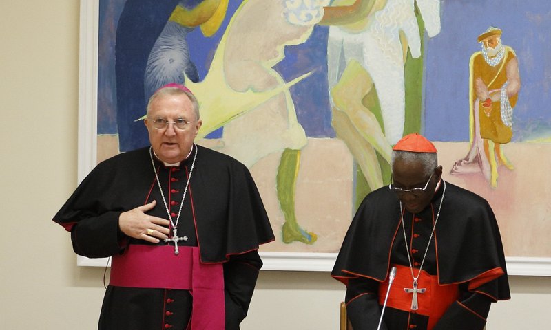 Archbishop Arthur Roche, secretary of the Congregation for Divine Worship and the Sacraments, is pictured with Cardinal Robert Sarah, prefect of the same congregation, as they pray with U.S. bishops at the start of a meeting at the Vatican in this Jan. 14, 2020, file photo. The Vatican announced May 27 that Pope Francis has appointed the English archbishop to lead the Congregation for Divine Worship and the Sacraments, succeeding Cardinal Sarah. (CNS photo/Paul Haring)