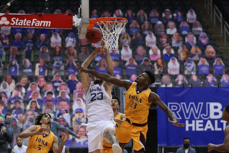 Iona Gaels forward Nelly Junior Joseph defends against Seton Hall Pirates forward Sandro Mamukelashvili Nov. 30, 2020, at Prudential Center in Newark, N.J. Results of a national poll released May 26, 2021, by Seton Hall University show 60% of U.S. sports fans favor vaccine requirement for event attendance and 72% want social distancing sections. (CNS photo/Vincent Carchietta, USA TODAY Sports via Reuters)