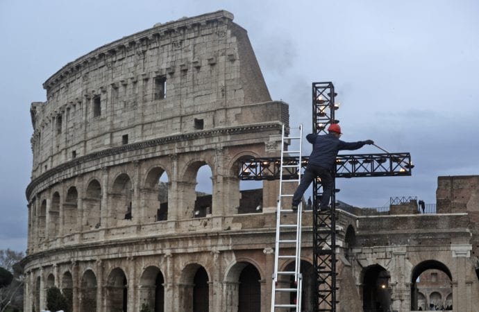 A worker prepares the cross ahead of Pope Francis arrival for the Via Crucis (Way of the Cross) torchlight procession on Good Friday, March 30, 2018. (Gregorio Borgia/AP via Crux)