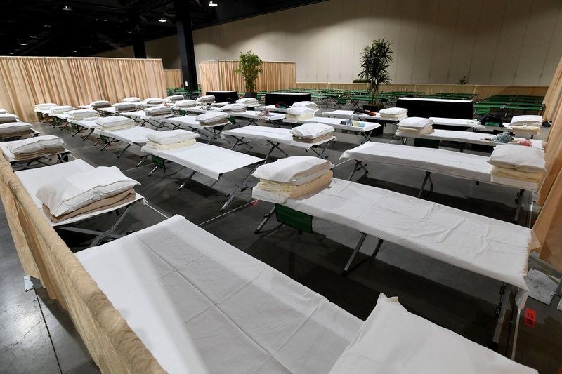 Beds for parentless migrants at the Long Beach Convention Center in April. The center is able to house up to 1,000 children. (Brittany Murray/Pool)