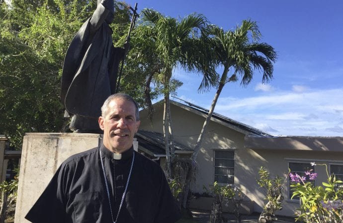 Archbishop Michael Byrnes poses for a photo in front of his residence in Hagatna, Guam, Friday, March 3, 2017. (AP Photo/Grace Garces Bordallo via Crux)