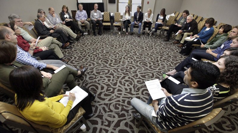 People gather to talk about media and communication during the Focolare Expo 2013 in Chicago. (CNS photo/Karen Callaway, Catholic New World)