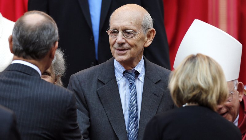 U.S. Supreme Court Justice Stephen Breyer, center, shakes hands with Chief Justice John Roberts following the annual Red Mass at the Cathedral of St. Matthew the Apostle in Washington, D.C. (CNS photo/Jonathan Ernst, Reuters)