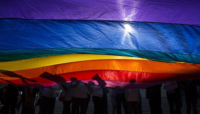 In this 2015 file photo, supporters for same-sex marriage wave a flag outside the U.S. Supreme Court in Washington, D.C. (CNS photo/Tyler Orsburn)