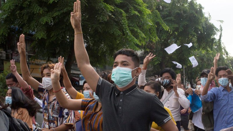 Anti-coup protesters flash the three-finger salute during a protest in Yangon, Myanmar, June 3, 2021. A third church in Kayah state, a Catholic stronghold in eastern Myanmar, was damaged by indiscriminate shelling by the military June 6. (CNS photo/Reuters)