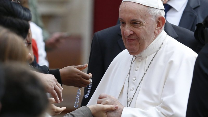 Pope Francis greets people during his general audience in the San Damaso Courtyard of the Apostolic Palace at the Vatican June 9, 2021. (CNS photo/Paul Haring)