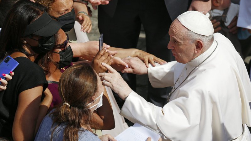 Pope Francis greets people his general audience in the San Damaso Courtyard of the Apostolic Palace at the Vatican June 16, 2021. (CNS photo/Paul Haring)
