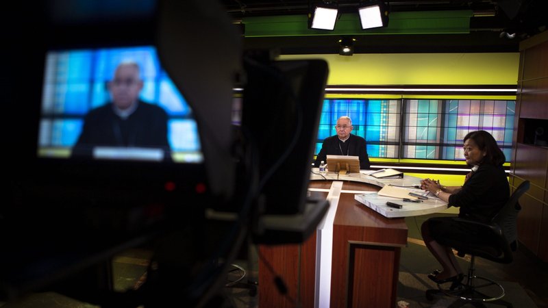 Archbishop José H. Gomez of Los Angeles, president of the U.S. Conference of Catholic Bishops, and Chieko Noguchi, USCCB director of public affairs, hold a news conference at the USCCB headquarters in Washington June 16, 2021, the first day of the bishops' three-day spring assembly, held virtually due to concern over COVID-19. (CNS photo/Tyler Orsburn)