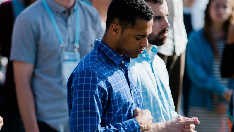 Franco Watts, a missionary with the Fellowship of Catholic University Students, or FOCUS, prays the rosary at the University of Mary in Bismarck, N.D., June 13, 2018. (CNS photo/Grant Whitty, courtesy FOCUS)