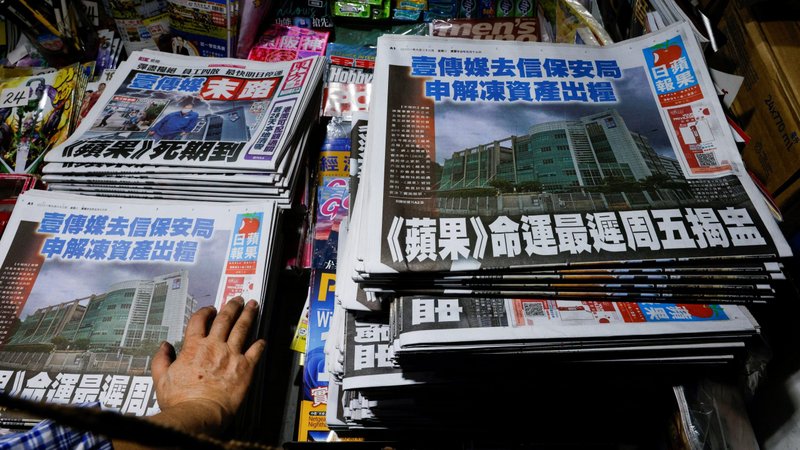 Copies of the Apple Daily newspaper are seen at a newspaper stand in Hong Kong June 22, 2021, following police raids and the arrest of executives. With its Catholic owner in jail and its assets frozen, the pro-democracy newspaper announced it will close. (CNS photo/Tyrone Siu, Reuters)