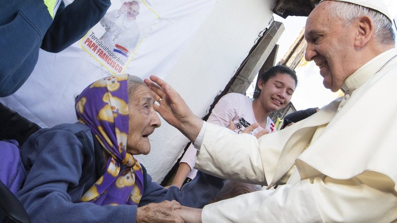 Pope Francis greets an elderly woman as he meets with people in Asuncion, Paraguay, in this July 12, 2015, file photo. The pope has started a new observance called World Day for Grandparents and the Elderly, to be celebrated for the first time July 25, 2021. (CNS photo/Paul Haring