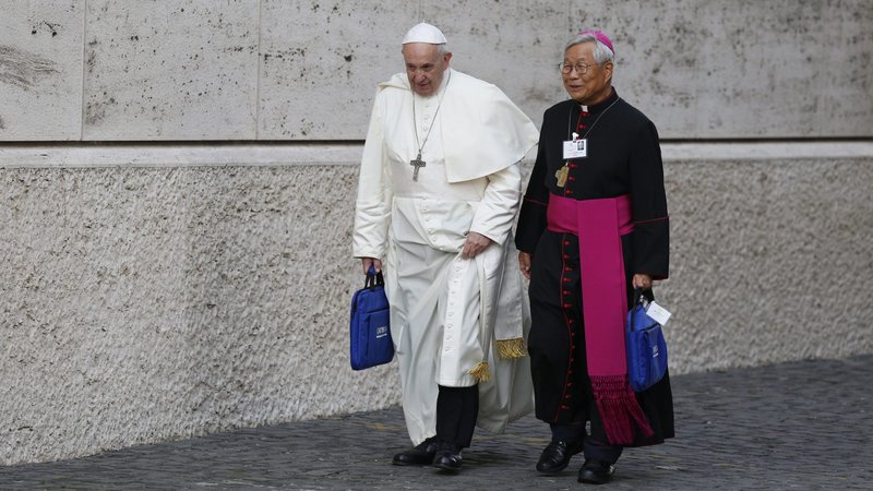 Pope Francis and then-Bishop Lazarus You Heung-sik of Daejeon, South Korea, arrive for a session of the Synod of Bishops on young people, the faith and vocational discernment at the Vatican in this Oct. 16, 2018, file photo. (CNS photo/Paul Haring)