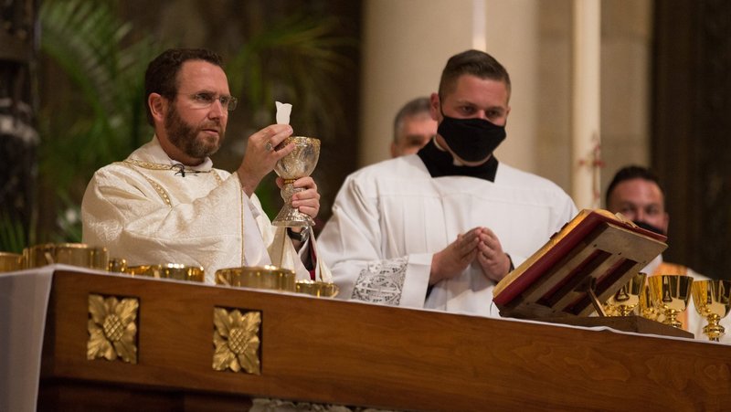Auxiliary Bishop Andrew H. Cozzens of St. Paul and Minneapolis celebrates the Eucharist May 8, 2021, at the Cathedral of St. Paul in. St. Paul, Minn. He is chairman of the U.S. bishops' Committee on Evangelization and Catechesis. (CNS photo/Dave Hrbacek, The Catholic Spirit)