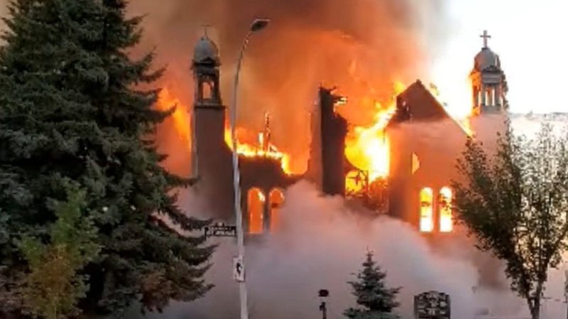Flames engulf St. Jean Baptiste Church in Morinville, Alberta, June 30, 2021, in this still image taken form video obtained from social media. The early morning fire destroyed the century-old Catholic church near Edmonton and is being treated as suspicious by Royal Canadian Mounted Police. (CNS photo/Diane Burrel, social media via Reuters)
