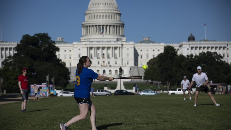 People play softball near the U.S. Capitol in Washington June 24, 2021. (CNS photo/Tyler Orsburn)