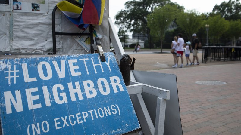 A "Love Thy Neighbor: No Exceptions" sign is seen near the White House in Washington July 7, 2021. (CNS photo/Tyler Orsburn)