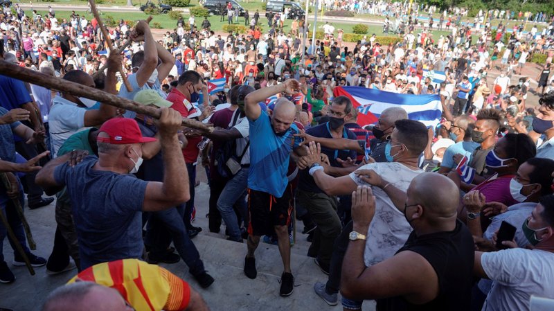 People clash with plainclothes police during protests in Havana July 11, 2021. Thousands of Cubans took to the streets to protest a lack of food and medicine as the country undergoes a grave economic crisis aggravated by the COVID-19 pandemic and U.S. sanctions. (CNS Photo/Alexandre Meneghini, Reuters)