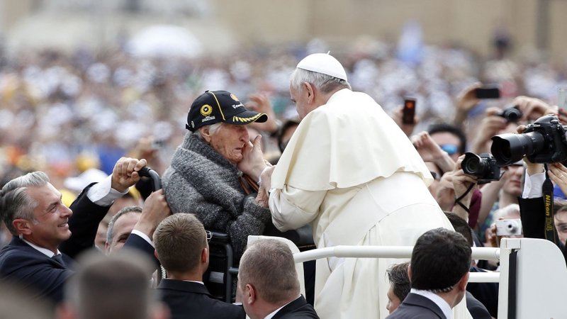An elderly woman becomes emotional as Pope Francis greets her as he arrives for a May 2014 weekly audience in St. Peter's Square at the Vatican. Pope Francis wanted the first World Day for Grandparents and the Elderly on July 25 to be inaugurated as the world seeks to recover from a deadly pandemic, calling for the faithful to be "angels," who care, console and caress. (CNS photo/Tony Gentile, Reuters)