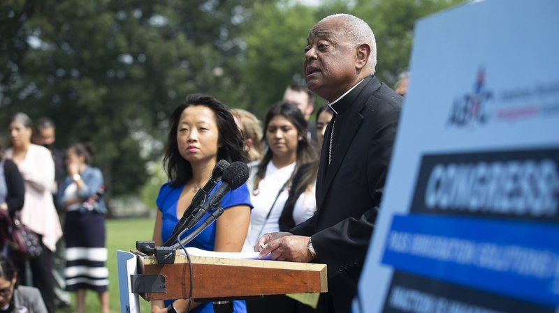 Washington Cardinal Wilton D. Gregory in remarks outside the U.S. Capitol in Washington July 21, 2021, urges Congress to support immigration solutions that protect families. Also pictured is Rebecca Shi, executive director of the American Business Immigration Coalition. (CNS photo/Tyler Orsburn)