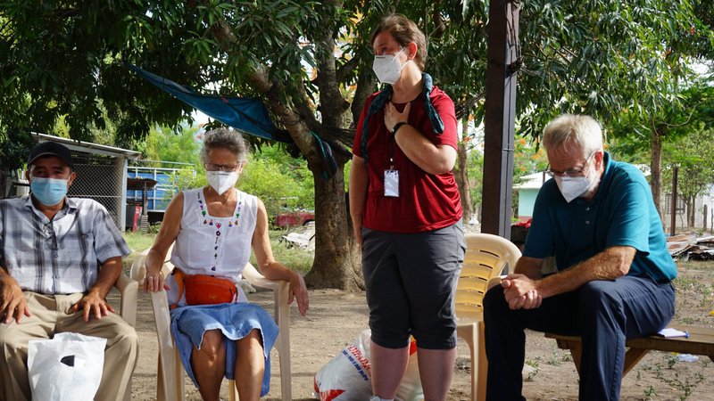 Mercy Sister Mary Kay Dobrovolny, standing, is pictured in early July speaking with a delegation from the U.S. in Honduras. In the solidarity trip, the U.S. visitors learned about conditions that fuel northward migration. (CNS photo/courtesy SHARE)