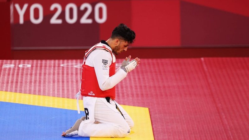 Abdullah Sediqi of the Refugee Olympic Team reacts after competing in the Taekwondo Men's Featherweight in the 2020 Tokyo Olympics July 25, 2021. This year's Refugee Olympic Team was made up of 29 athletes from a dozen countries who have been living and training in host countries. (Murad Sezer/CNS, Reuters via Crux)