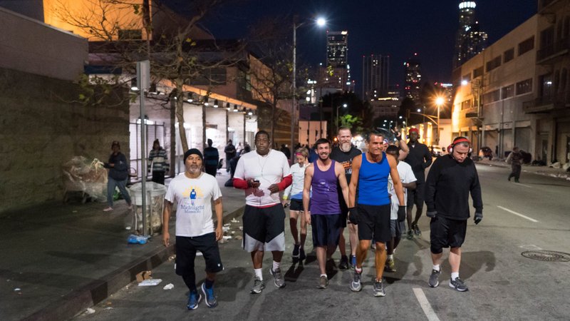 Judge Craig J. Mitchell (blue tank top) leads a group of runners through downtown Los Angeles. (Mark Hayes)