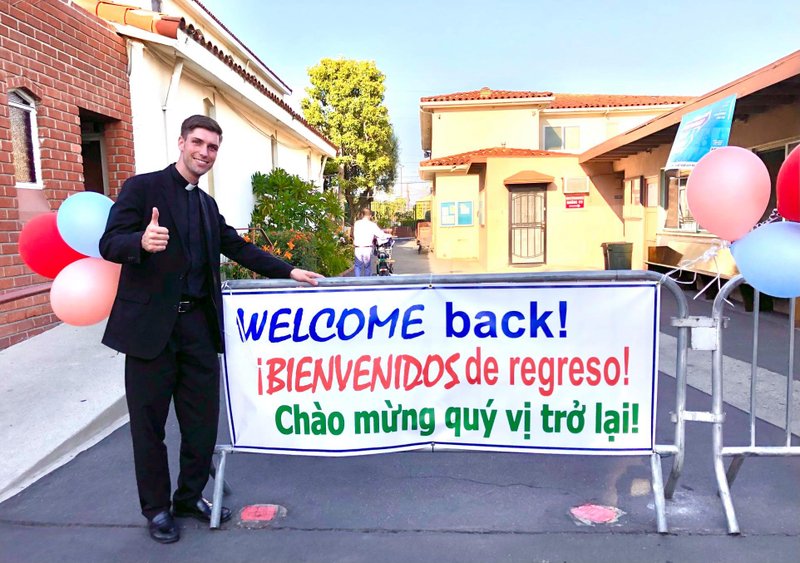 Father Matt Wheeler welcomes parishioners back to Mass at St. Anthony Church in San Gabriel on June 20, his birthday.