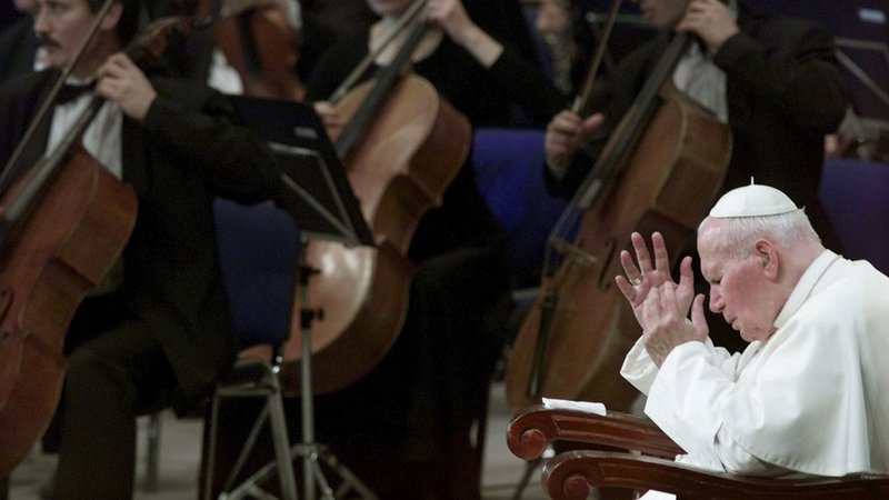 St. Pope John Paul II gestures during a concert performance in Astana, Kazakhstan, Sept. 24, 2001, two weeks after the 9/11 attacks. (CNS)