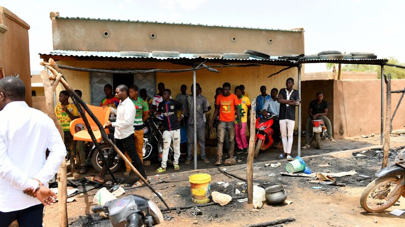 Residents gather June 7, 2021, at the site of an attack in the village of Solhan, Burkina Faso. Bishop Laurent Dabire of Dori condemned the June 5 attack by Islamists that left at least 160 people dead and urged residents to "keep faith and stay united." (CNS photo/Burkina Faso Prime Minister's Press Service handout via Reuters)