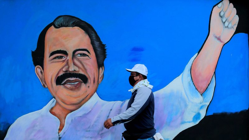 A man wearing a protective mask walks by a mural depicting Nicaraguan President Daniel Ortega in Managua March 30, 2020, during the COVID-19 pandemic. (CNS photo/Oswaldo Rivas, Reuters)