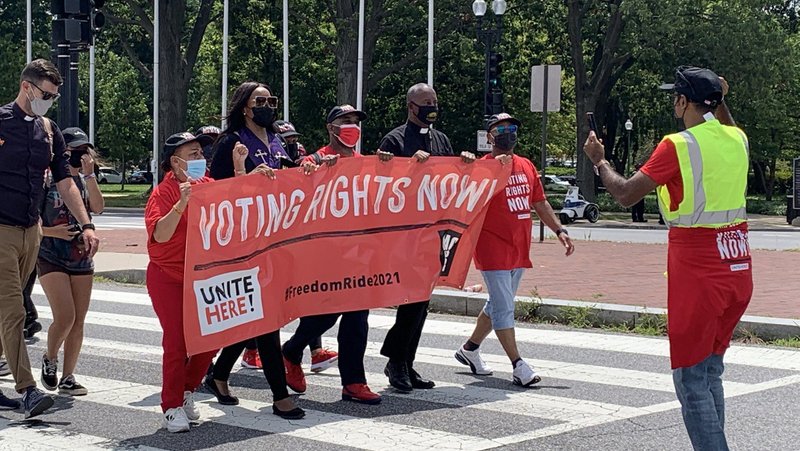 Men and women from different religious groups march toward the U.S. Capitol in Washington Aug. 2, 2021, during a protest for voting rights and economic justice organized by the Poor People's Campaign: A National Call for Moral Revival. (CNS photo/Melissa Cedillo, National Catholic Reporter)