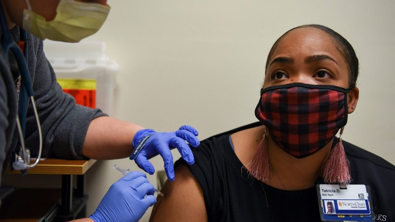 A woman receives a COVID-19 vaccine at North Oaks Medical Center in Hammond, La., Aug. 5, 2021. Results of a new poll released Aug. 5 showed many parents are hesitant about COVID-19 vaccines for their children. (CNS photo/Callaghan O'Hare, Reuters)