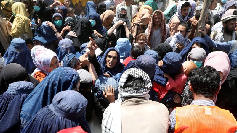 Internally displaced families from northern provinces of Afghanistan, who fled from their homes due the fighting between Taliban and Afghan security forces, take shelter at a public park in Kabul Aug. 10, 2021. (CNS photo/Reuters)