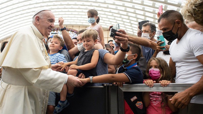 Pope Francis greets people during his general audience in the Vatican's Paul VI hall Aug. 18, 2021. The pope continued his series of talks on St. Paul's Letter to the Galatians. The pope said the law was meant to teach the path toward true freedom and not subjugate people in "a kind of preventive custody." (CNS photo/Vatican Media)