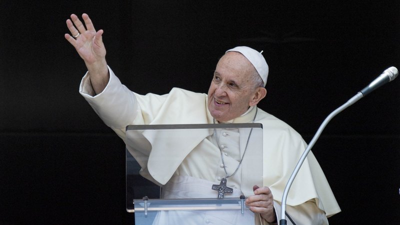 Pope Francis greets the crowd as he leads the Angelus from the window of his studio overlooking St. Peter's Square at the Vatican Aug. 22, 2021. (CNS photo/Vatican Media)